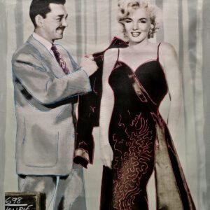 Man helps woman into glamorous evening gown
