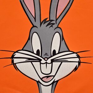 Smiling Bugs Bunny face on orange background