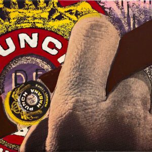 Hand holding cigar with Punch label
