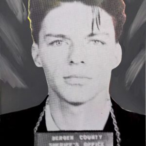 Black and white mugshot of man holding placard