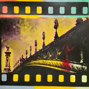 Filmstrip-framed ornate bridge with lampposts