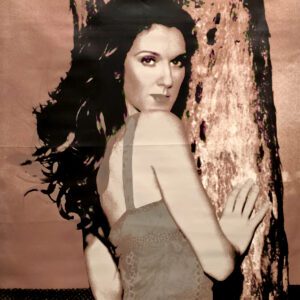 Sepia-toned portrait of woman leaning on tree