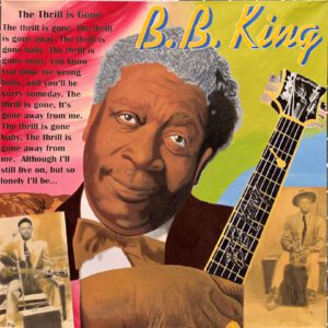 Portrait of blues musician with guitar and lyrics